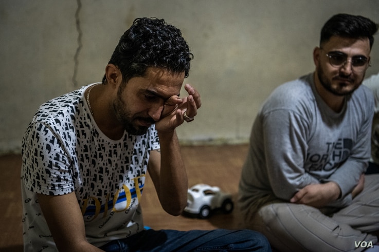 Omid Suleyman Zada, 26 weeps while describing the death of his brother at the hands of Taliban fighters on April 10, 2021 in Van, Turkey (VOA/Claire Thomas)