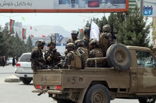 Taliban special force fighters arrive inside the Hamid Karzai International Airport after the U.S. military's withdrawal, in…