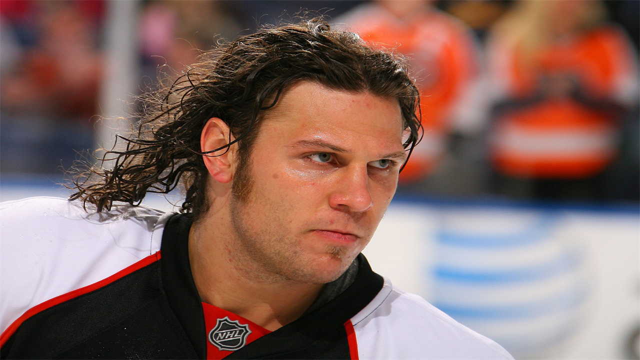 A photo of a younger Riley Cote skating before a hockey match in 2009.
