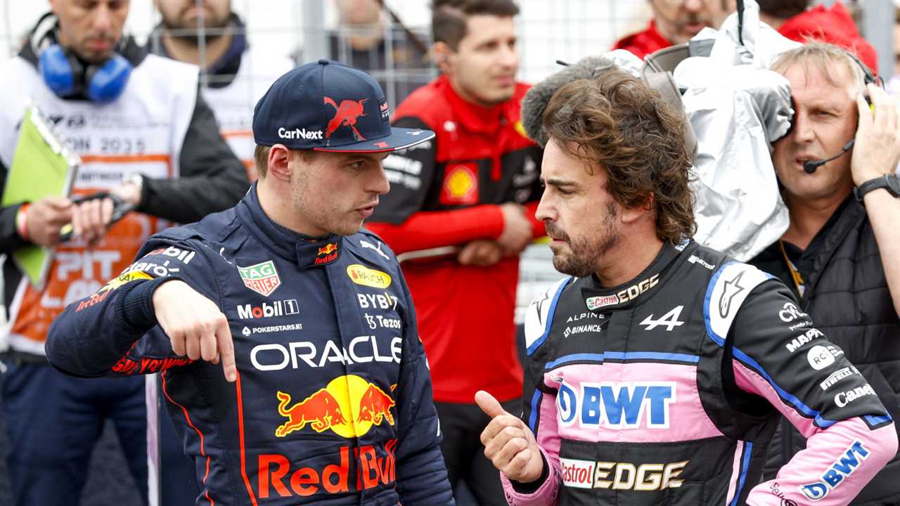 Max Verstappen discussing something with Fernando Alonso. Canada June 2022