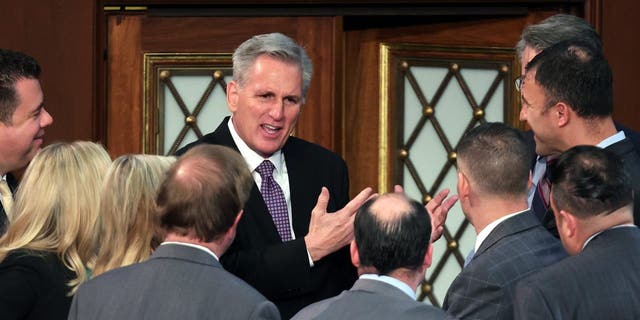 US House Republican Leader Kevin McCarthy (R-CA) talks to members-elect in the House Chamber during the second day of elections for Speaker of the House at the US Capitol Building on January 04, 2023 in Washington, DC. 
