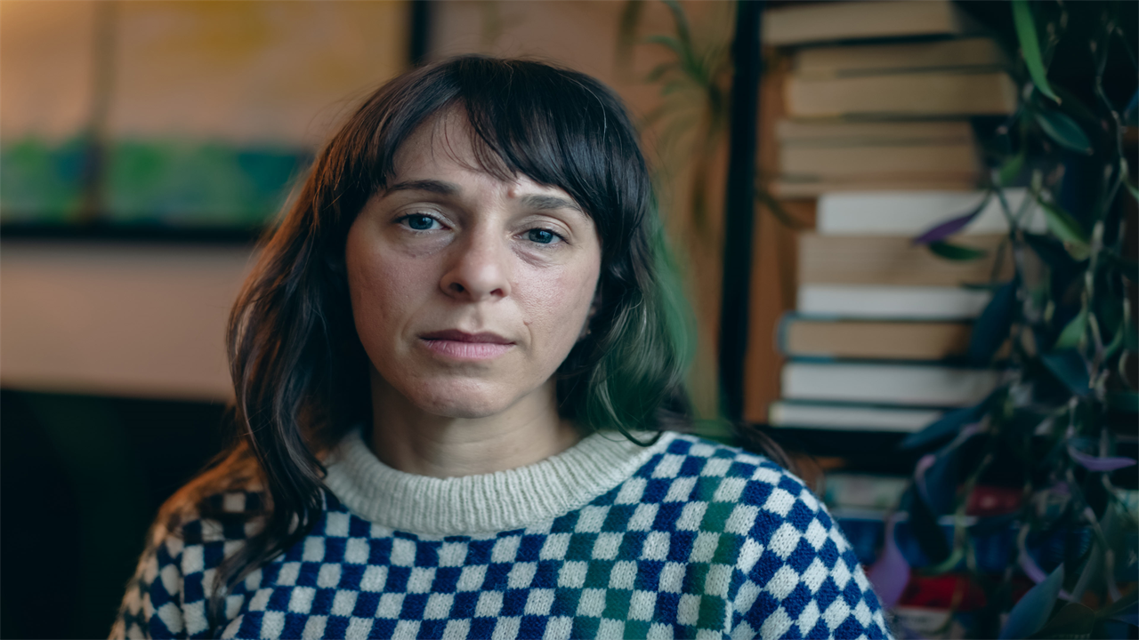 A portrait of a woman indoors.
