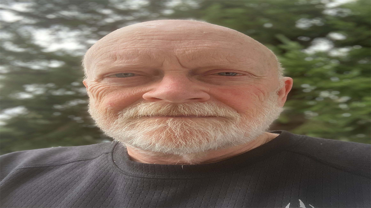 A photo of an older man outside.