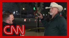 CNN reporter talks to Trump conspiracy theorist at Biden's inauguration