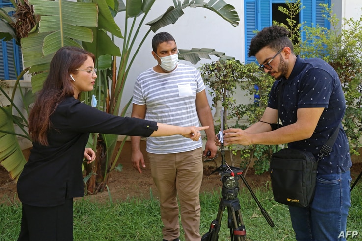 Al Jazeera journalists go live from  the National Syndicat (SNJT) headquarters in the Tunisian capital Tunis on July 26, 2021. …