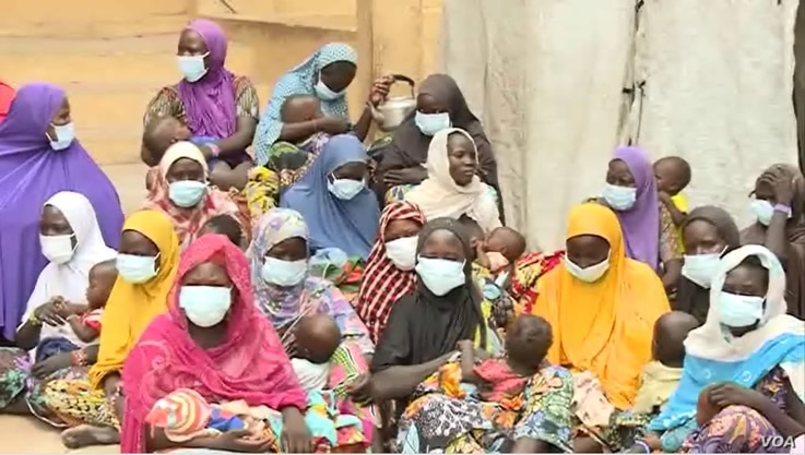 Wives of Boko Haram fighters and their children are seen at the DDR Center in Meri, Cameroon, July 29, 2021.