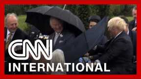 Boris Johnson's umbrella struggle makes Prince Charles laugh