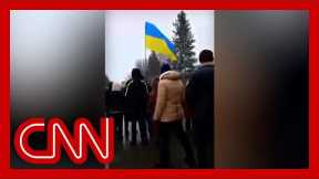 Crowd of Ukrainian protesters stands ground as gunfire starts