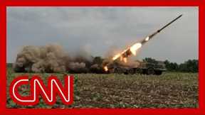 Soldiers take rocket launcher out of hiding and fire at Russians