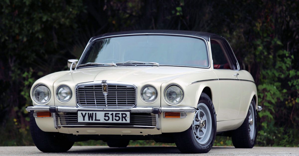 White 1976 Jaguar XJ-12 C on the road