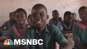 K.I.N.D. Student Sits At A Desk For The First Time