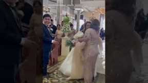 Bride walks down flooded aisle after Typhoon in the Philippines