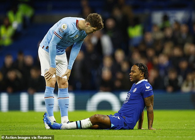 Mendy joins Raheem Sterling on the sidelines after he picked up a hamstring injury