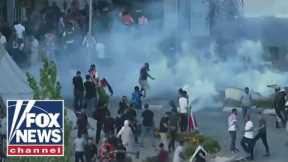 DEVELOPING: Riot police clash with protesters in West Bank