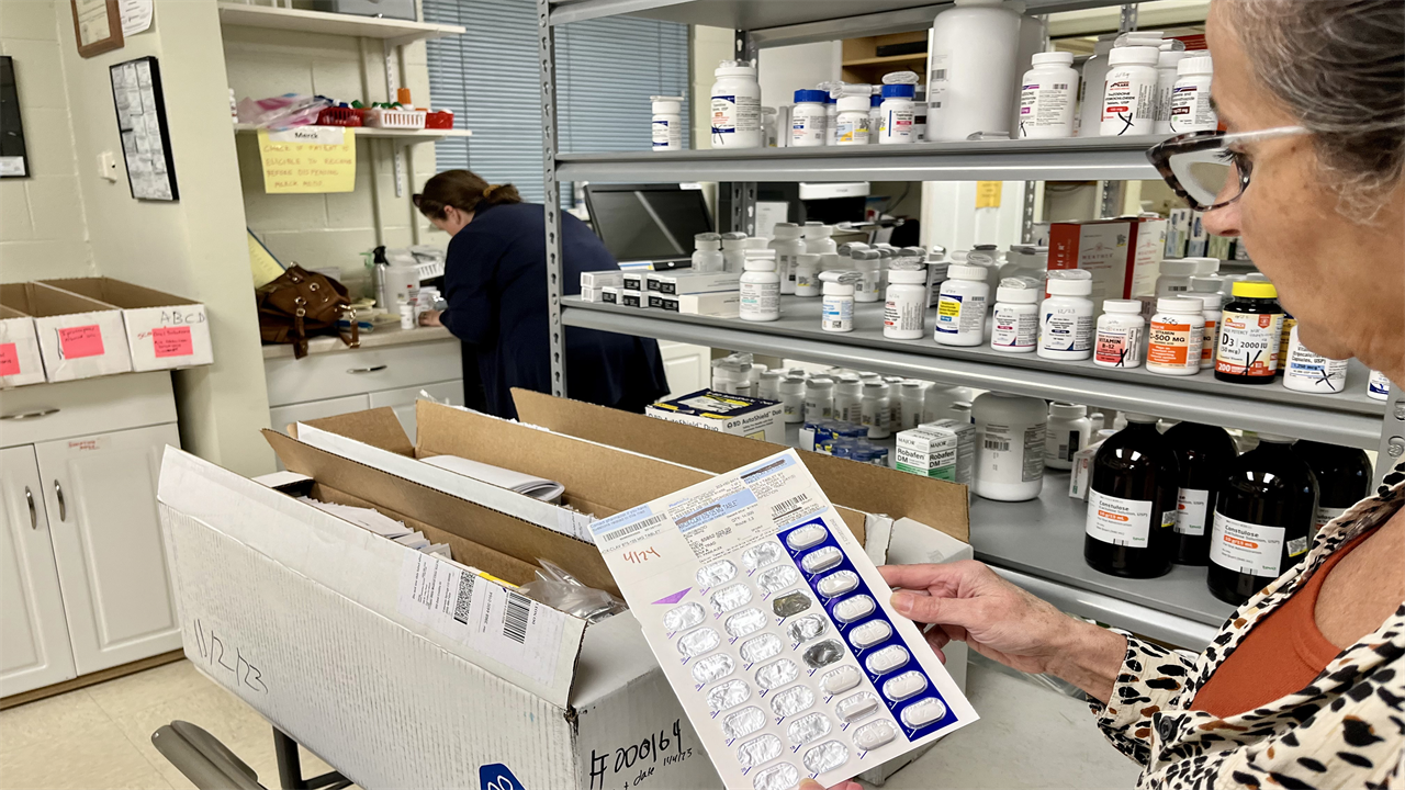 Pharmacist Frieda Martin holds a donated medication blister pack at Open Bible Clinic and Pharmacy in Colorado Springs, Colorado, on Nov. 7, 2023.