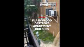 Flash flood destroys apartment building