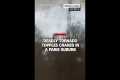 Deadly tornado topples cranes in a