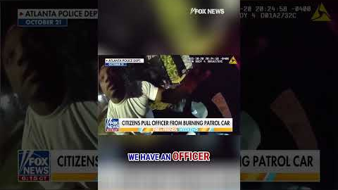 SEE IT: Bystanders pull police officer from burning patrol car #shorts #foxnews #us #news