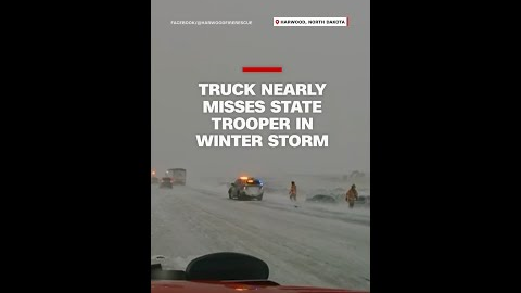 Truck narrowly avoids state trooper in winter storm