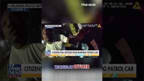 SEE IT: Bystanders pull police officer from burning patrol car #shorts #foxnews #us #news