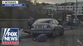 JARRING footage shows civilians trying to disarm Australia terror suspects