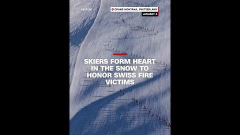 Skiers form heart in the snow to honor Swiss fire victims