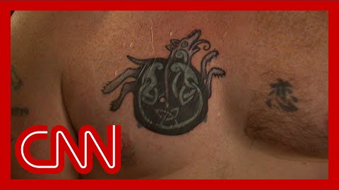 Democratic Senate candidate says he covered up tattoo once linked to Nazi symbol