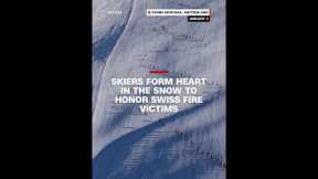Skiers form heart in the snow to honor Swiss fire victims