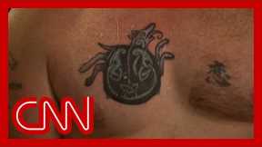 Democratic Senate candidate says he covered up tattoo once linked to Nazi symbol