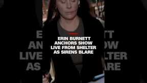 Erin Burnett anchors show live from shelter as sirens blare